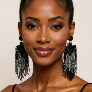 Close-up of a model wearing Oh, These Sequin Earrings with layered fringe in slate, smoke, and espresso tones.
